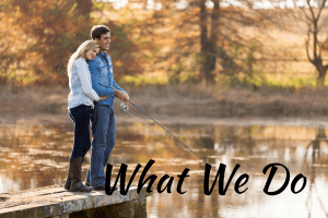 In love young couple intimate together by a lake